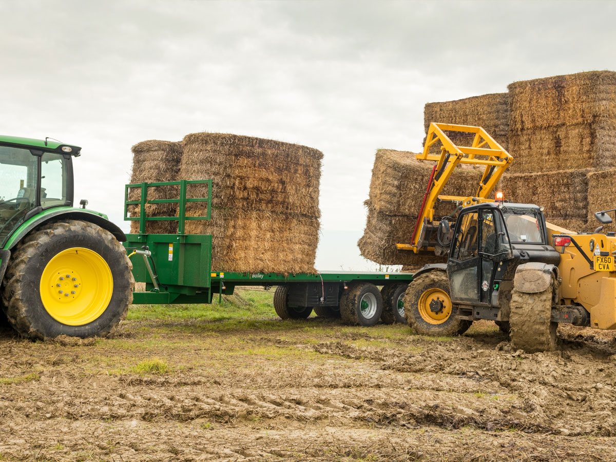 Bales being loaded onto a Bailey trailer