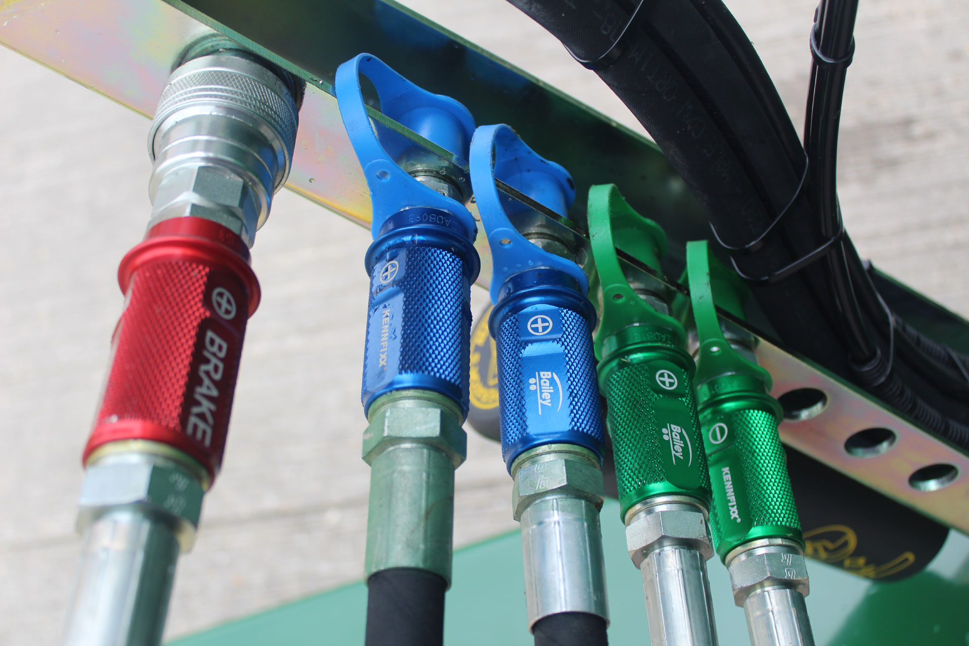 Colour coded hydraulic hose grips on a Bailey Trailer